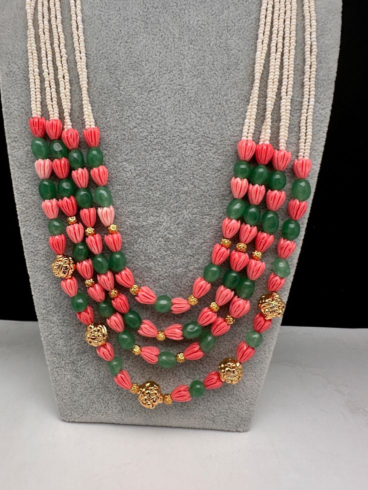 Coral Emerald Nakshi Multi Layer Necklace Only Neckalce no earringsColor : GoldenSize : Necklace Length : 22 Inches Approx;Stones : Pearl Real Emeralds Tulip Beads and Nakshi Balls Traditional Pink Jewelry With Polished Beads, Traditional Bridal Necklace With Pink Round Beads, Festive Multicolor Gemstone Beads Jewelry, Handmade Green Kundan Beaded Necklaces, Handmade Oval Beads Necklace For Festivities, Traditional Pink Necklaces With Dangling Beads, Traditional Pink Bridal Necklace With Round Beads, Pink Bridal Necklace With Round Beads For Festivals, Temple Jewelry Necklaces With Colorful Beads For Festivals