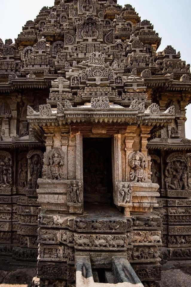 an intricately carved stone structure with carvings on it