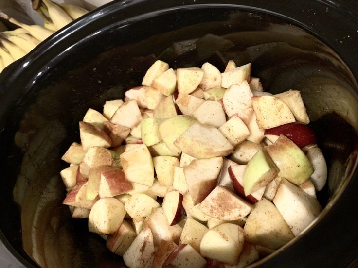 chopped apples are in the crock pot ready to be cooked