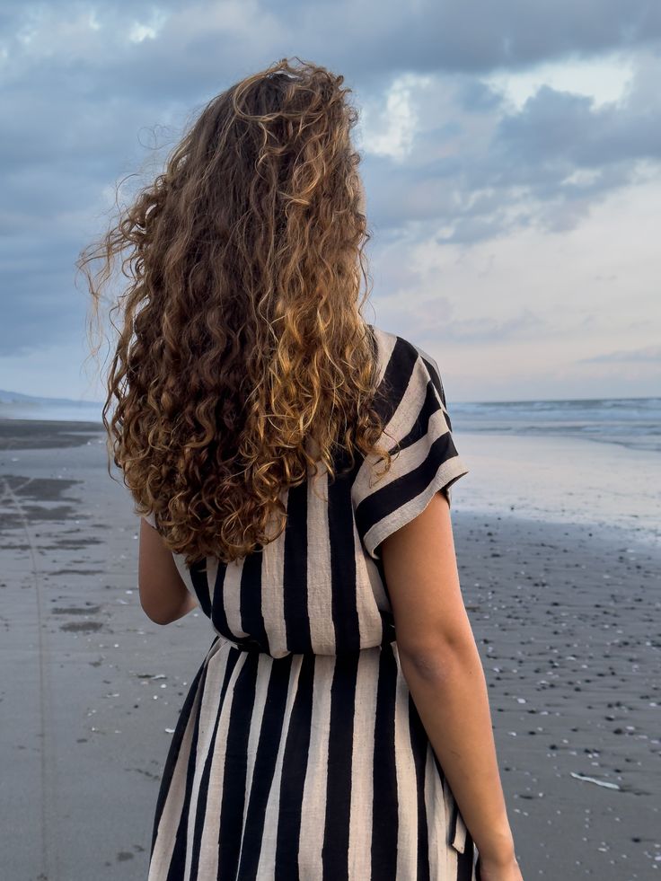 The Black & White Striped Dress, created in collaboration with Erica Kim, combines timeless design with modern elegance. The bold stripes make a striking statement, while the cap sleeves and round neckline add a delicate touch of femininity. Crafted from soft, breathable fabric, this dress offers both comfort and style. Its versatile design allows it to be dressed up or down, making it a perfect choice for any occasion—from casual outings to more refined gatherings. Effortlessly chic, this dress Black Dresses With Contrast Stripes For Summer, Elegant Short Sleeve Dress With Vertical Stripes, Black Summer Dresses With Contrast Stripes, Black Summer Dress With Contrast Stripes, Black Dress With Vertical Stripes And Short Sleeves, Black Short Sleeve Dresses With Vertical Stripes, Black Short Sleeve Dress With Vertical Stripes, Black White Striped Dress, Handwoven Fabric