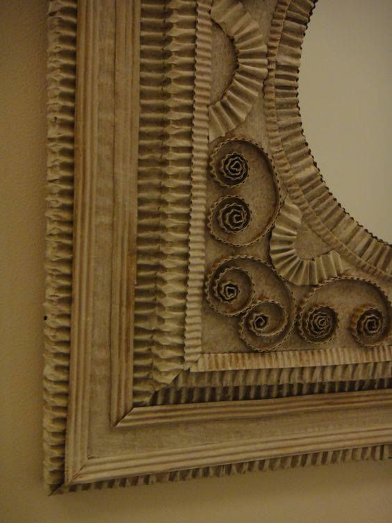 a decorative mirror hanging on the wall