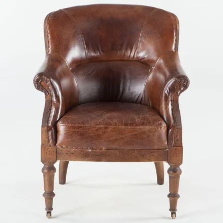 a brown leather chair with wooden legs and arm rests on an isolated white background,