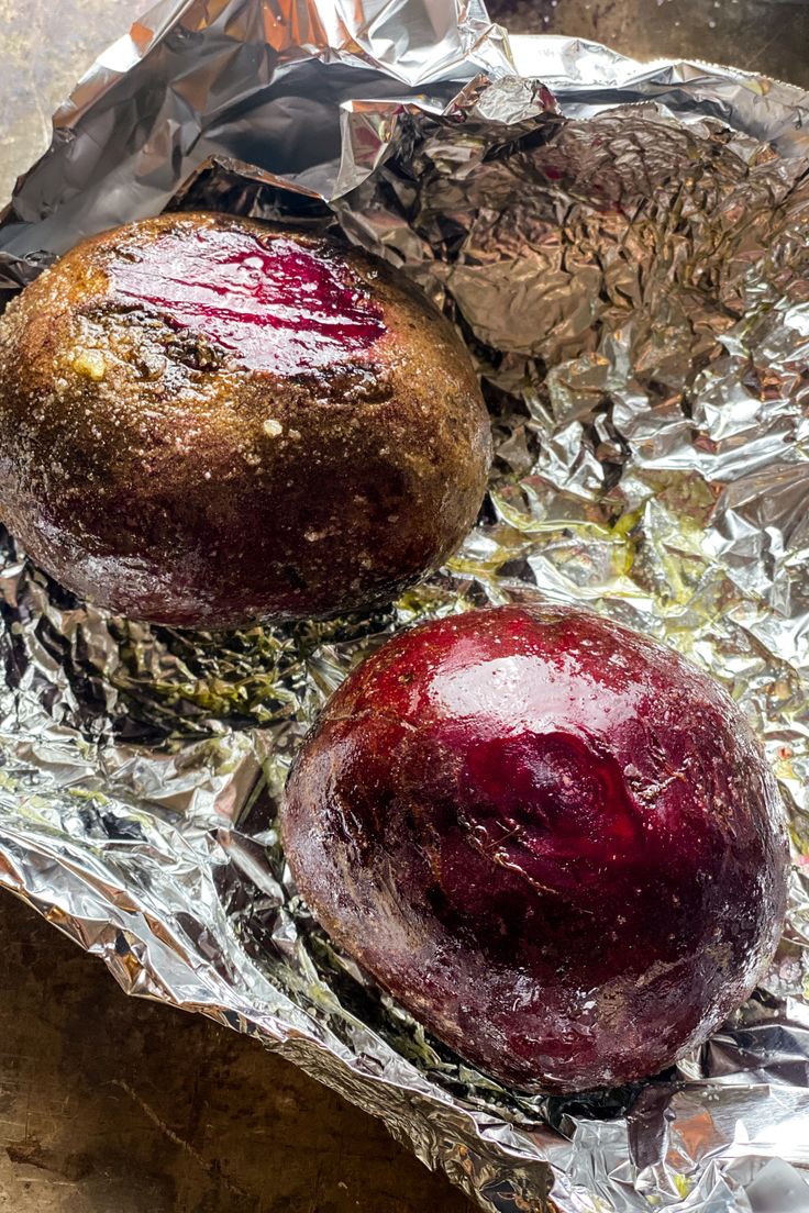 two baked goods sitting on top of tin foil