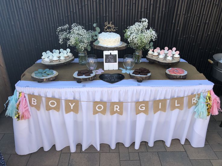 a table topped with cupcakes and desserts