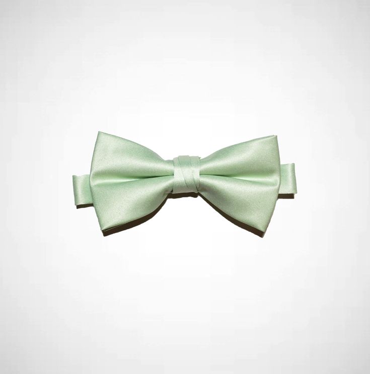 100% Satin Poly Pre-tied with adjustable strap 4 3/4" x 2 1/4" Light Green Bow Tie, Standard Tie Satin Bow, Classic Summer Bow Ties, Classic Summer Bow Tie, Elegant Summer Satin Bow Tie, Adjustable Solid Satin Bow, Summer Formal Pre-tied Bow Tie, Summer Formal Ties With Satin Bow, Elegant Pre-tied Bow Tie For Summer