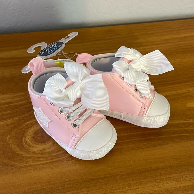 First Steps Pink Baby Sneakers New With Tags. Cute Shinny Baby Shoes. White High-top Booties With Soft Sole, White Lace-up Booties With Soft Sole, White Soft Sole Booties For First Birthday, White Soft Sole Booties For Playtime, Playful White Booties For Playtime, Cute White Booties With Soft Sole, Cute White Spring Booties, Casual High-top White Booties, Casual White High-top Booties