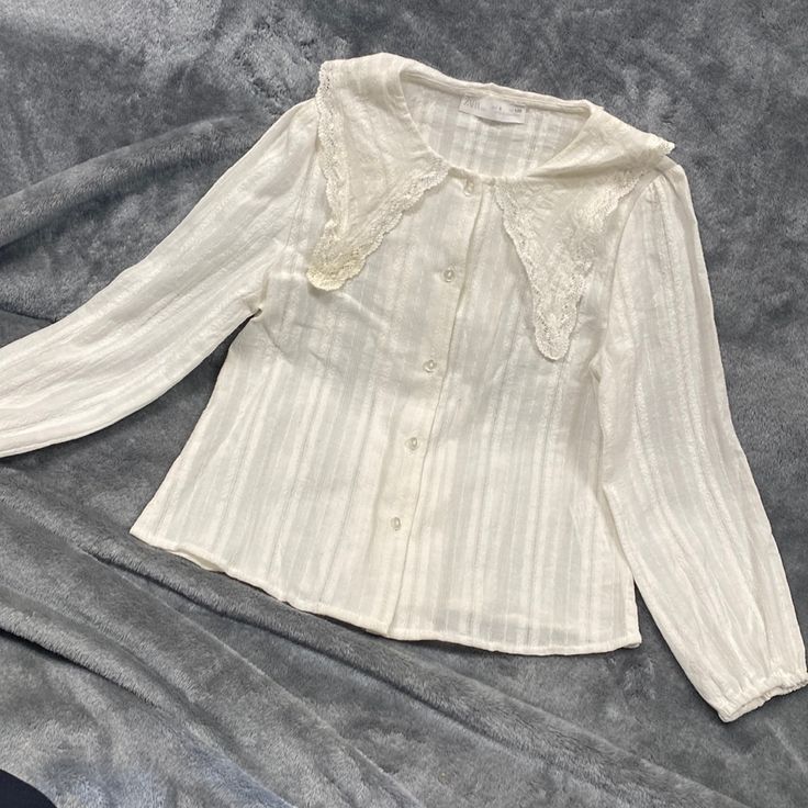 Zara Cream Blouse For Girls ,Nwot Size 8 Perfect Condition But Has A Little Spots Casual White Tops With Cute Collar, Cream Top With Lace Collar For Spring, Cream Lace Collar Top For Spring, Cute Zara Long Sleeve Blouse, Summer Daywear Tops With Cute Collar, Cotton Tops With Cute Collar For Fall, Spring Daywear Tops With Peter Pan Collar, Cottagecore Long Sleeve Tops For Spring, Cute Fitted Zara Top