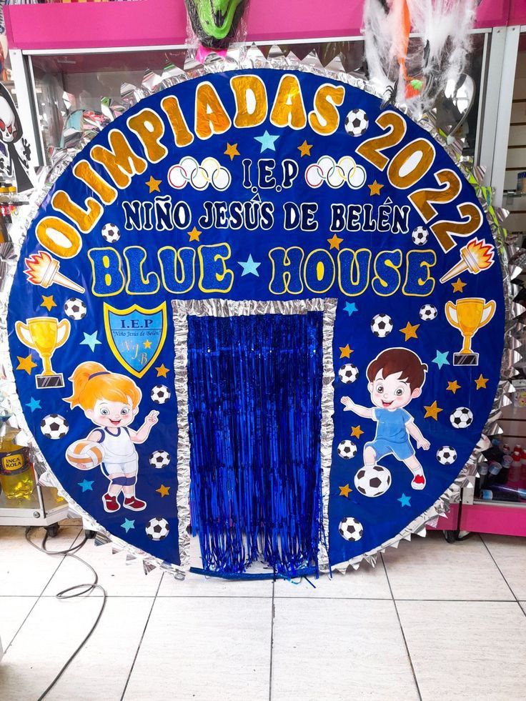 a blue house sign with children's pictures on it