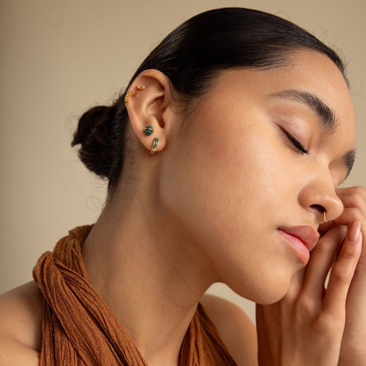 Presenting our Herkimer Malachite Studs, blending earthy charm with a touch of sparkle✨ These earrings feature dainty geometric Malachite gemstones in a Herkimer Diamond shape, known for their rich green hues and natural patterns. Perfect for adding a unique flair to your everyday look, they're sure to become a favorite in your jewelry collection! SKU: RR-ER463 Product Details Material: High Quality Solid 925 Sterling Silver Finish: Sterling Silver ∙ 18K Gold Featuring dainty ~8x5mm Malachite CZ Nature-inspired Green Jewelry With Matching Earrings, Green Minimalist Drop Earrings, Minimalist Single Green Earring, Bohemian Green Earrings With Gemstone Accents, Adjustable Green Gemstone Jewelry, Green Fusion Style Jewelry With Birthstone, Green Fusion Style Birthstone Jewelry, Green Fusion Style Drop Earrings, Green Birthstone Earrings