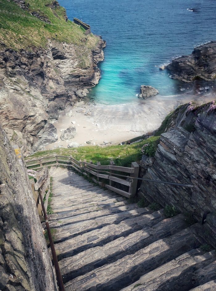 stairs lead down to the beach and ocean