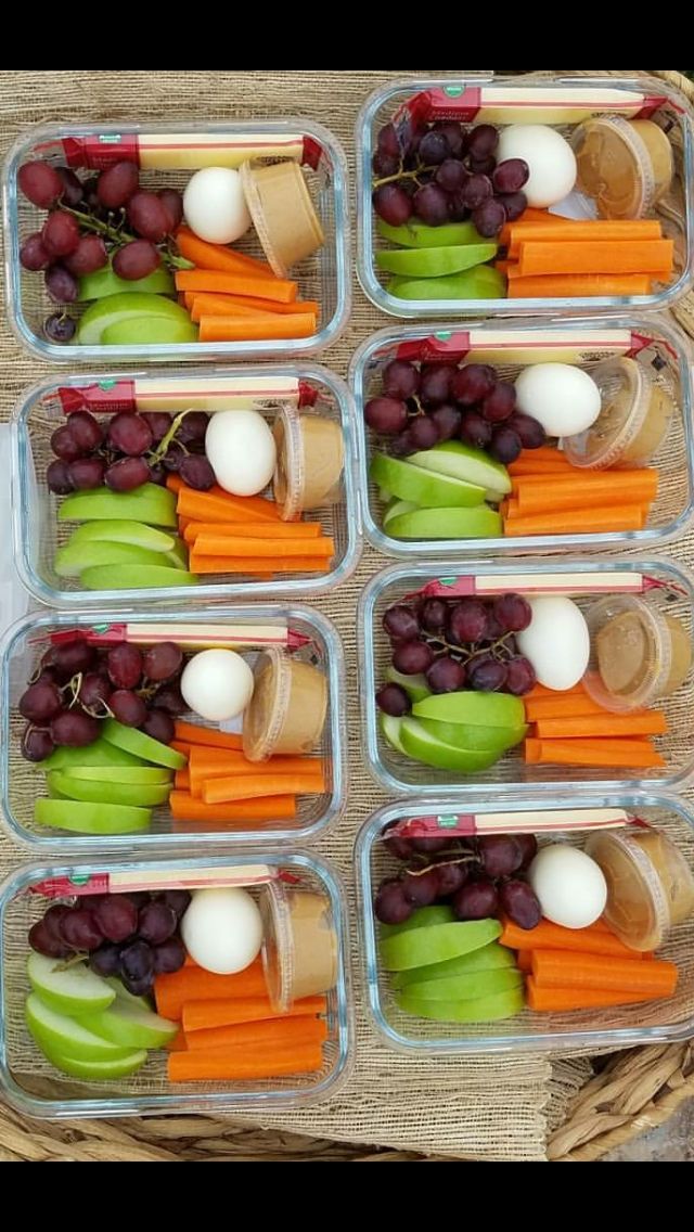 several containers filled with different types of fruits and vegetables