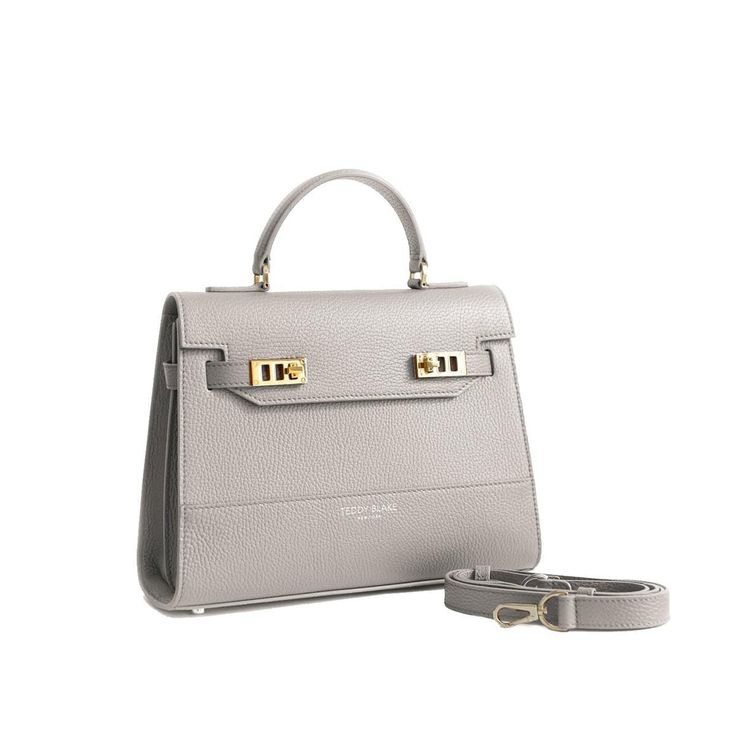 DESIGN
The stunning Kim shoulder bag is perfect for adding a dash of chic to any ensemble. Made in Italy from soft pebbled leather, this versatile piece has an intriguing look, that will complete any style in a memorable way. This style can be used as a handbags or a shoulder bag, taking you from day to evening with ease.
DESCRIPTION
Made In ItalyStampatto leatherPebbled calf leather with matching trimMicrofiber interiorGold-toned detailing
DETAILS
8.6"h x 4"w x 11"l3" handle drop35" to 47" deta Teddy Blake, Walker Shoes, Platform Slippers, Clutch Pouch, How To Make Handbags, Designer Clothes For Men, Toddler Girl Outfits, Autumn Fashion Women, Slip On Sneakers