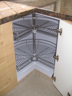 the corner of a kitchen counter with a metal rack