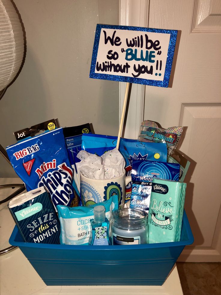 a blue basket filled with items sitting on top of a counter