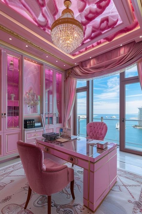 a pink desk with chairs and a chandelier hanging from it's ceiling