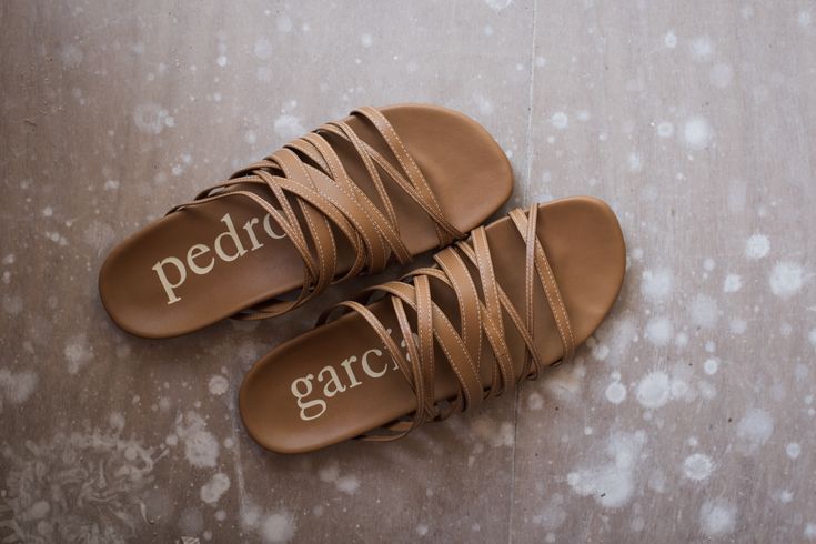 Artisanal sandals that inspire comfort and creativity, this piece is meant to be cherished. Style/ Bety: mixed strappy slide in terra nappa. Pic by @tasyamenaker #PedroGarciaShoes #madeinspain #ethicalfashion #artisanmade Chic Leather Slides With Leather Footbed, Casual Open Toe Calf Leather Slides, Casual Calf Leather Slides With Removable Insole, Chic Calf Leather Slides With Round Toe, Chic Leather Slides With Leather Lining, Spring Leather Slides With Stitched Sole, Leather Slides With Stitched Sole For Spring, Chic Brown Leather Slides, Chic Spring Calf Leather Slides