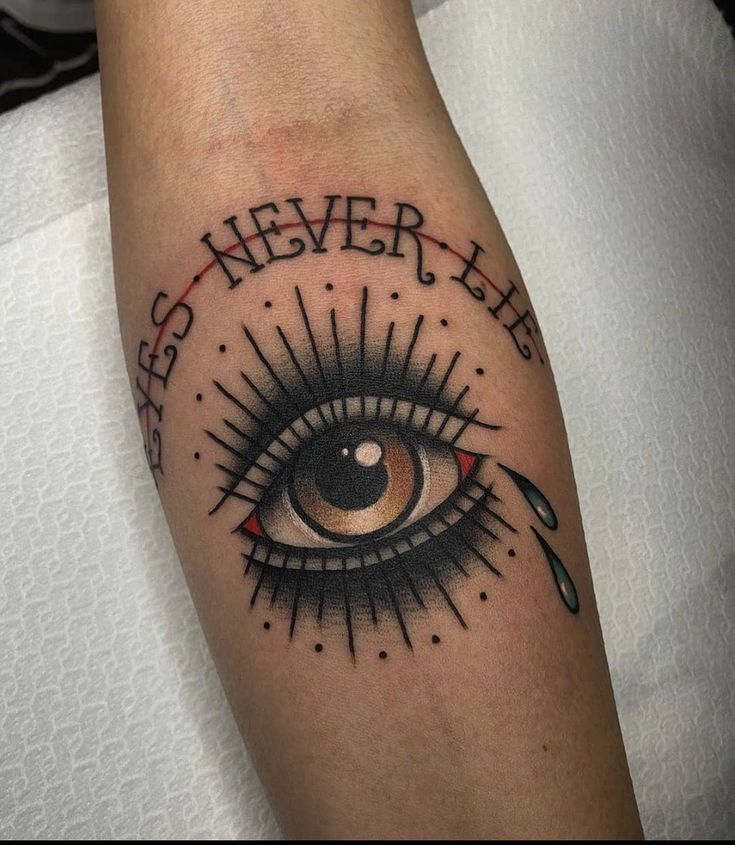 a tattoo with an eye and words on the side of it that says, eyes never lie