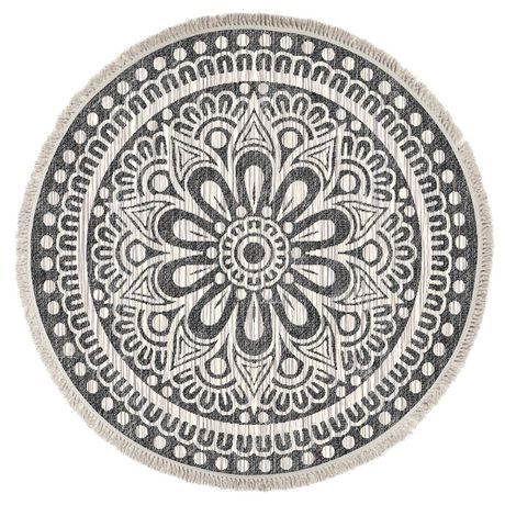 a black and white circular rug with an intricate design