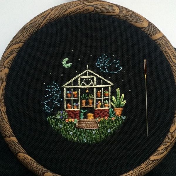 the embroidery is done and ready to be sewned into something else that looks like a house