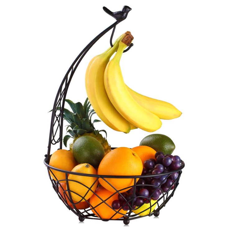 a fruit basket with bananas, oranges and grapes