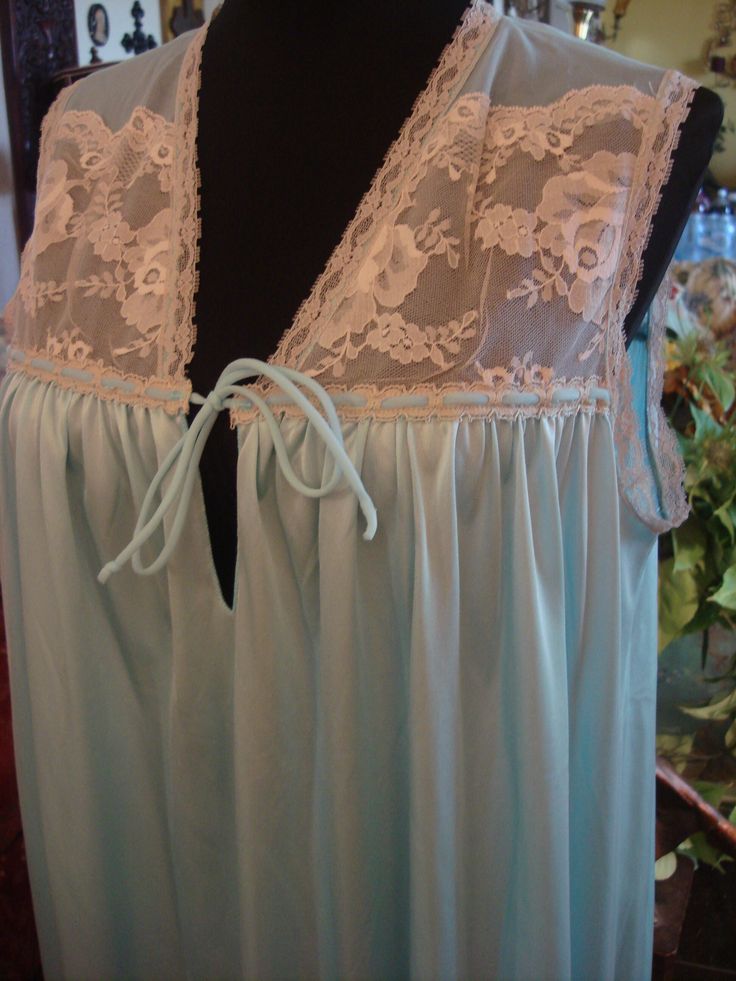 Vintage 1990s Beautiful Light Blue long gown trimmed in antique pearl lace, lace on the upper chest area, sleeveless, Nylon, Vintage allure, timeless treasure, by Janelle of California, Handwand Cold, drip dry, bust 40 inches, Very Good Vintage Condition, Clean Sheer Sleeveless Lace Gown, Sleeveless Sheer Lace Gown, Sleeveless Lace Nightgown With Delicate Detail, Sleeveless Delicate Lace Nightgown, Sleeveless Sleepwear With Contrast Lace, Sleeveless Lace Gown With Delicate Details, Vintage Sleeveless Lace Nightgown, Sleeveless Nightgown With Lace Bodice, Sleeveless Lace Bodice Nightgown