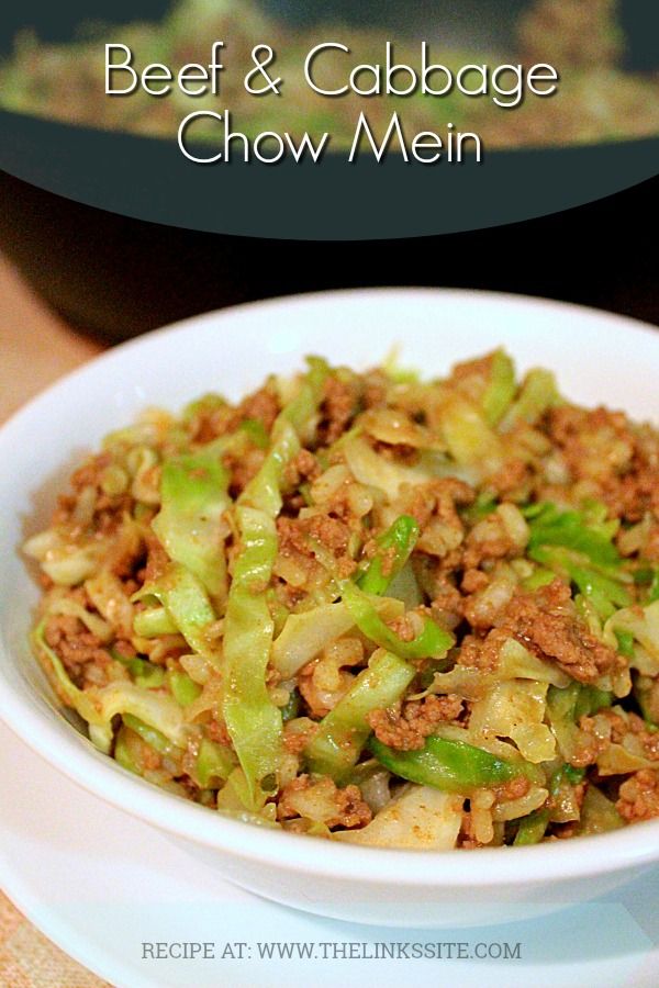 beef and cabbage chow mein in a white bowl