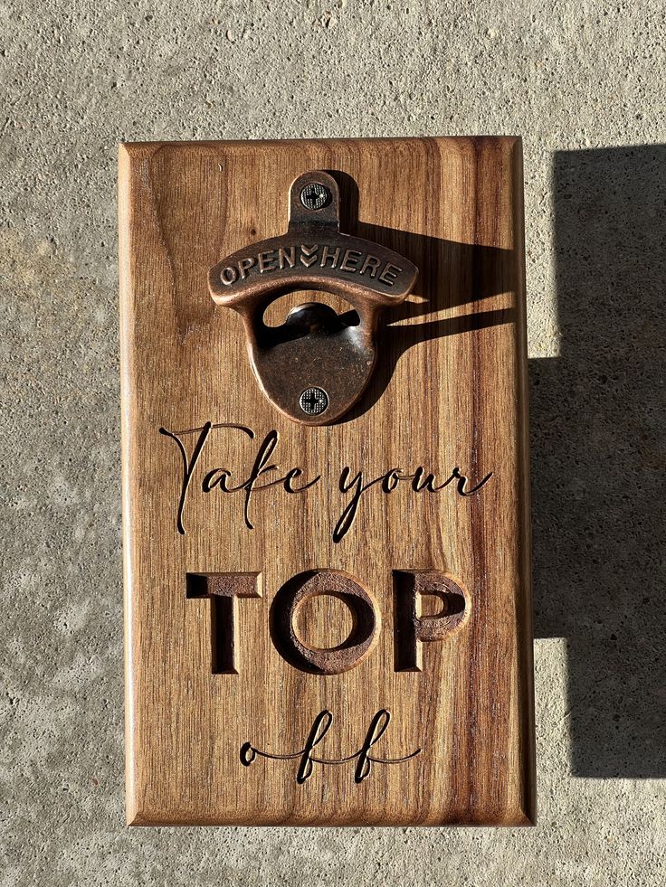 a wooden sign with the words, make your top off and an open wrench on it