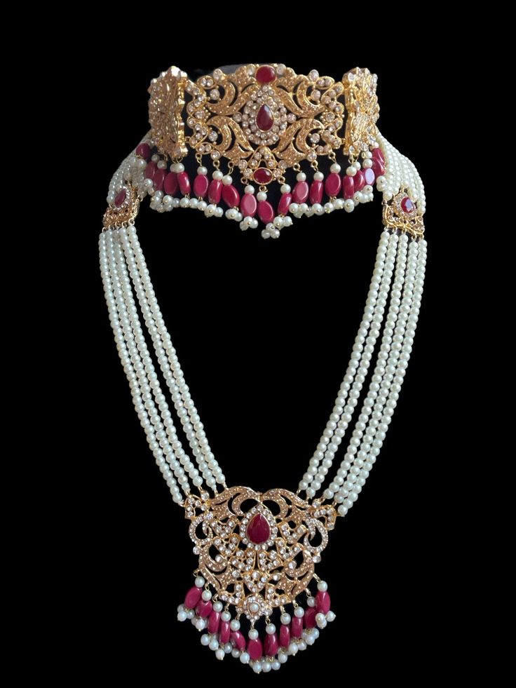 A must have for the upcoming wedding season! This bridal set is a unique blend of royal and modern with its pastel hues and gold plating. The set is gorgeous with pearls and is a full bridal piece but can be worn separately for a lighter and simple look. Set includes: mala , earrings, maang tikka , passa, choker In stock and ready to ship‰Û? Elegant Kundan Sets For Marriage, Elegant Tilla Wedding Sets, Elegant Wedding Sets With Tilla Details, Elegant White Tilla Sets, Elegant White Sets With Tilla Detailing, Kundan Bridal Necklace With Pearl Drop For Wedding, Elegant Tilla Jewelry Sets For Marriage, Elegant White Pearl Sets, Elegant Kundan Necklace With Pearl Chain For Wedding