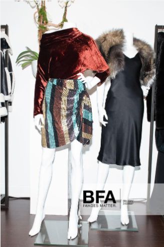 two mannequins dressed in clothes on display