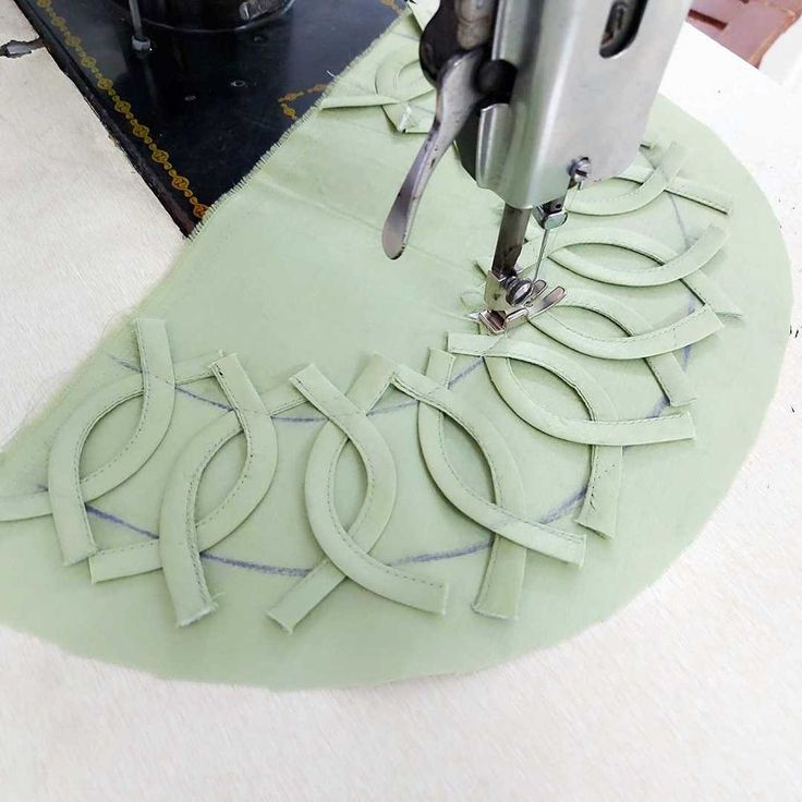 a machine is cutting out some paper on the table with it's cutters