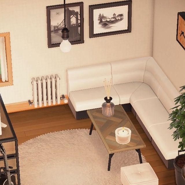 an overhead view of a living room with white furniture