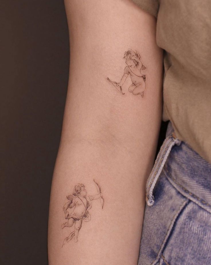 a woman's arm with a small tattoo on the left side of her arm