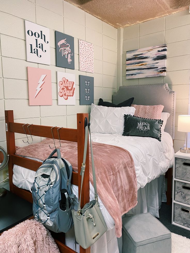 a room with a bed, purse and other items on the floor