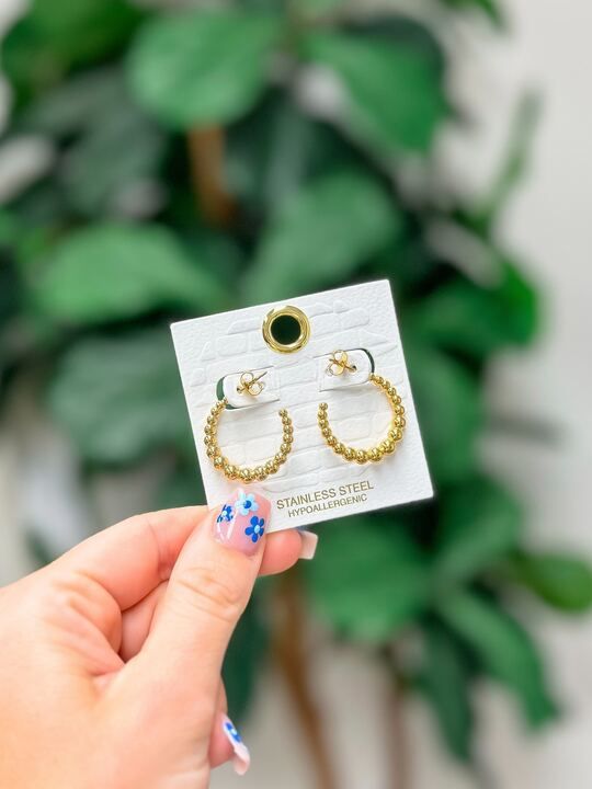 Expertly crafted from hypoallergenic stainless steel, these Classic Gold Ball Hoop Earrings are a must-have for any jewelry collection. With a delicate yet durable design, they provide the perfect finishing touch to any outfit. 1" Hoop Classic Gold, Jewelry Collection, Hoop Earrings, Stainless Steel, Gold, Design