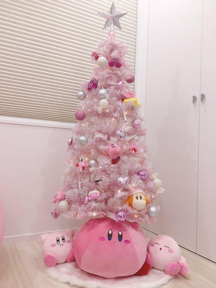 a pink christmas tree decorated with poop dolls