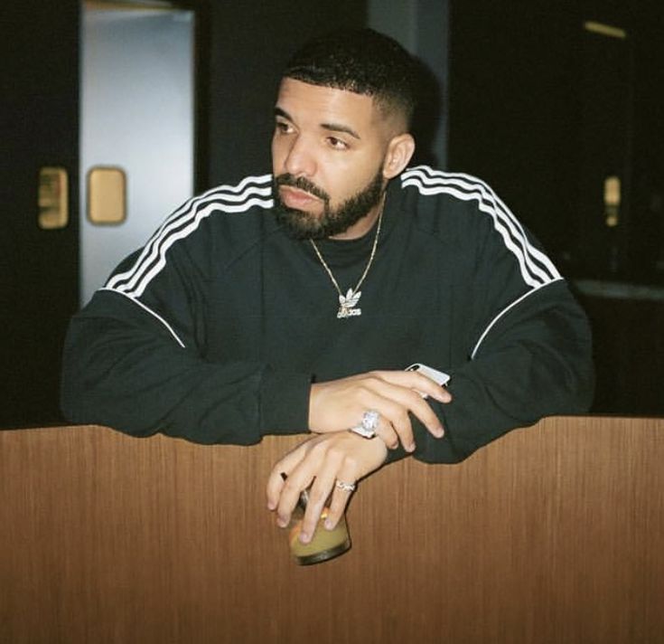 a man with a beard sitting at a table