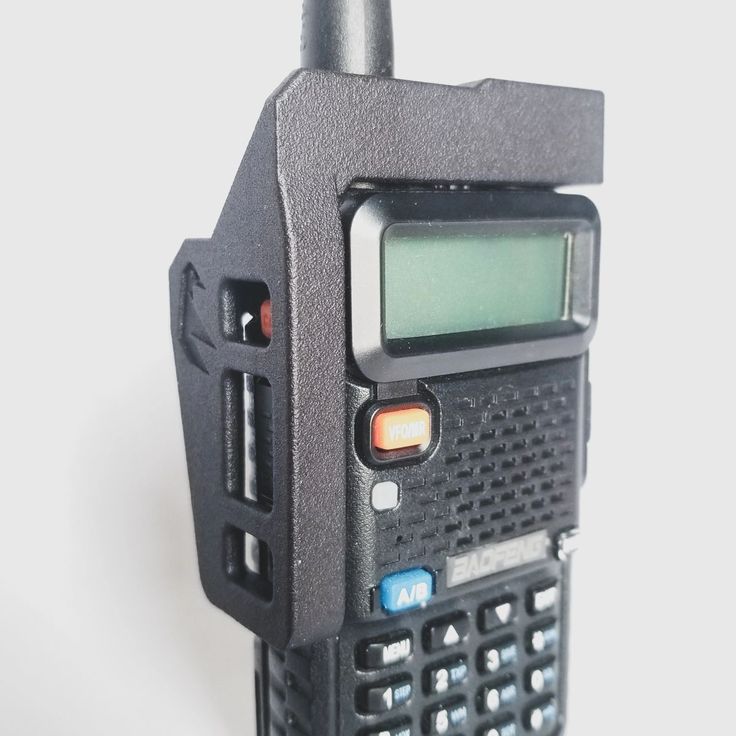 a close up of a radio on a white surface