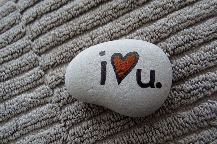 a rock with the word i love u painted on it