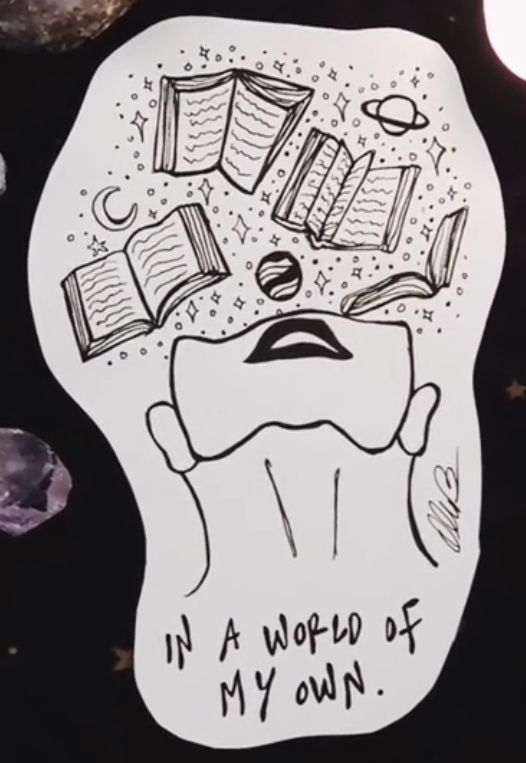 a paper cutout with books floating out of it's head and the words in a world of my own