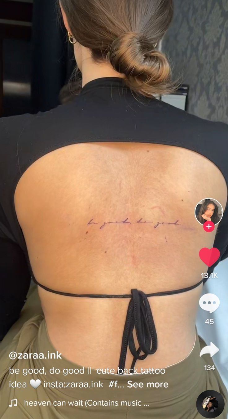 the back of a woman's neck with her name on it and an arrow