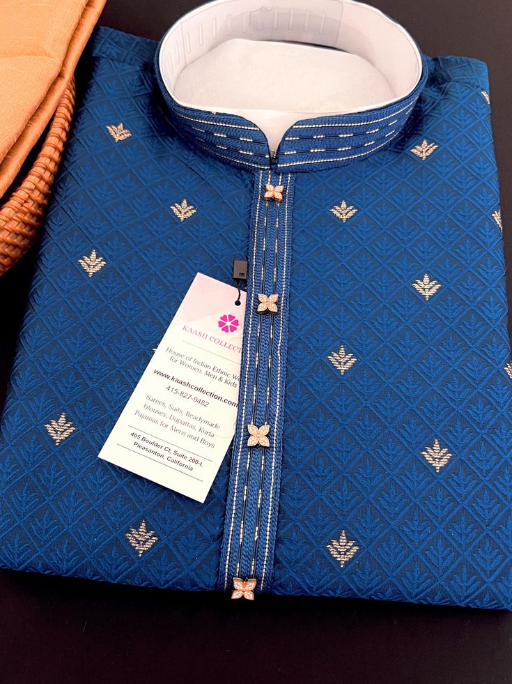 Soft and Premium quality Soft Silk Kurta Pajama in Peacock Blue color Small zari Butti Weaving with self design embroidery material. Item : Men's Kurta PajamaReady to Wear : YesKurta Color : Peacock Blue Pajama Color : GoldFabric : Soft Silk (Non-Prue) Pocket : YesLining (Yes/No) : No Disclaimer-For sizing please refer to the Size Chart given in the listing with the pictures. - Please do NOT go by the size of the Kurta that you already have from another maker. All makers have different size Char Indigo Kurta With Zari Work For Diwali, Traditional Indigo Kurta With Dabka, Festive Indigo Traditional Wear With Dabka, Traditional Blue Bandhgala With Chikankari Embroidery, Blue Bandhgala With Chikankari Embroidery For Festive Occasions, Blue Bandhgala With Resham Embroidery In Straight Kurta Style, Indigo Kurta With Dabka For Diwali, Traditional Indigo Semi-stitched Kurta, Traditional Indigo Embroidered Kurta