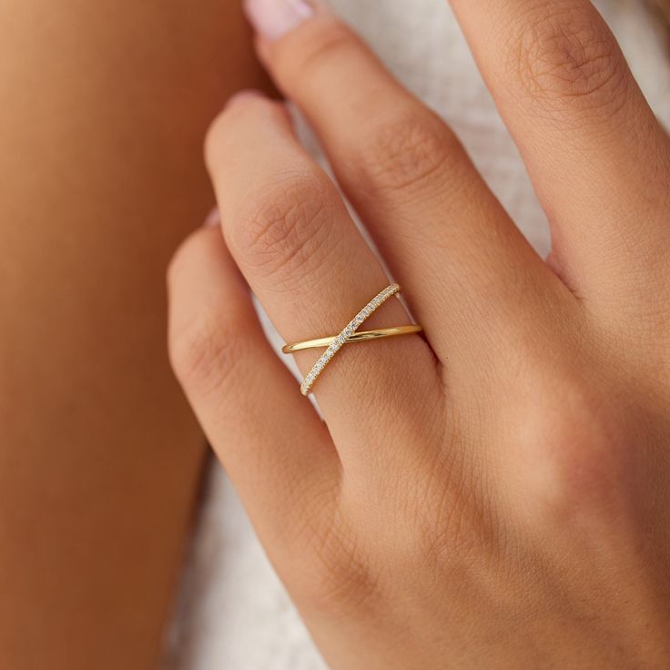 14k Gold Criss Cross Diamond Ring / Criss Cross Ring For Women / Solid Gold Statement Ring / Trendy Petite Dainty Diamond Ring by Ferkos ▶Item Details * Made to Order * Gold Kt: 14K (also available in 18K) * Available Gold Colors: Rose Gold, Yellow Gold, White Gold * Widest Part: 7.5MM * Round Diamond: 23 Pcs 1.0 MM * Diamond Color & Clarity: G Color SI Clarity * Diamond Ctw: 0.12 ctw * Ready to Ship in 3-10 Business Days ▶ See more of our Diamond Wedding Rings here - https://etsy.me/3YbpVq2 ▶ See our storefront here - http://etsy.me/2lUcVnH  ▶ All store sections here * Diamond Rings - http://etsy.me/2lwKUl8 * Diamond Earrings - http://etsy.me/2lyqVBP * Diamond Necklace - http://etsy.me/2mqa6O1 * Diamond Bracelets - http://etsy.me/2mVrAB5 * Diamond Wedding Rings - https://etsy.me/3YbpVq2 * 14k Gold Open Band Jewelry In Diamond White, Gold Sterling Silver Diamond Ring With Pave Setting, 14k Gold Bypass Ring With Single Cut Diamonds, Diamond White 14k Gold Open Band Jewelry, Dainty White Gold Ring With Pave Setting, Gold Diamond Open Band Jewelry, Fine Jewelry Open Band Diamond Ring, Dainty Jewelry Open Ring With Brilliant Cut, Dainty Wedding Ring With Pave Setting