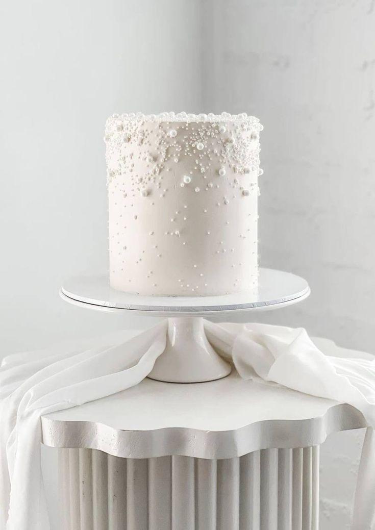 a white cake sitting on top of a table