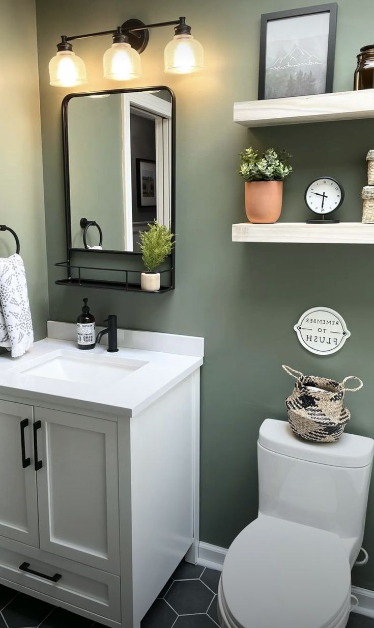 a white toilet sitting next to a sink in a bathroom under a mirror and lights