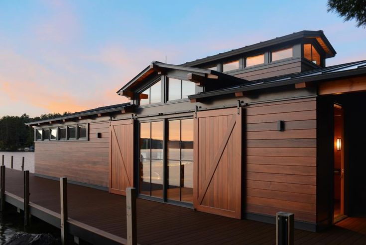 a house on the water with its doors open