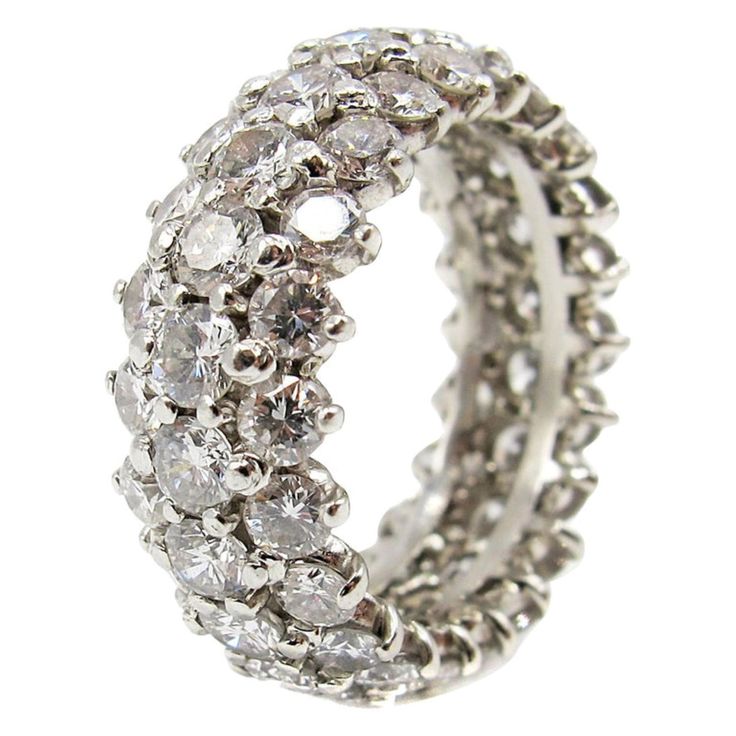 This extremely well handcrafted platinum diamond eternity band is set with 66 bright, white and sparkly round brilliant cut diamonds. The diamonds are all perfectly matched in color, cut and clarity. The average color of the diamonds is approximately E-F , with a clarity of VVS-VS.The total diamond weight is estimated Pearl Engagement Ring Set, Rings Multiple, Tiffany Wedding Rings, Contemporary Wedding Rings, Eternity Band Set, Platinum Diamond Wedding Band, Pearl Engagement Ring, Diamond Eternity Band, Princess Cut Engagement Rings