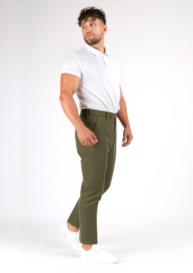 Crafted from a luxurious custom cotton blend, the Olive Cotton Pants offer a refined yet versatile look. These elegant trousers boast a timeless olive hue that will never go out of style. Effortlessly elevate any outfit with these sophisticated premium pants. Chic Olive Trousers, Chic Olive Pants For Work, Chic Olive Pants For Workwear, Elegant Green Bottoms With Welt Pockets, Olive Trousers For Workwear, Classic Green Bottoms With Straight Hem, Elegant Olive Bottoms For Workwear, Green Tapered Leg Pants For Business Casual, Green High-waisted Dress Pants For Business Casual