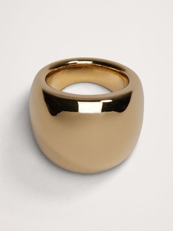 Our statement-scale dome ring is cast in bronze with a pleasing level of heft.  The bronze is plated in 12K gold or sterling silver and polished to a high shine.  Timeless Classics: Luxury, everyday.  A showcase of time-honored craftsmanship and skilled Italian artisans, these are the pieces you'll reach for season after season, delighting in their exceptional versatility and endless appeal.  12K-gold plated or silver-plated bronze.  Made in Italy.  Length: 1" Modern Gold Brass Signet Ring, Formal Brass Dome Ring With Polished Finish, Gold-tone Polished Metal Rings, Elegant Metal Dome Ring With Polished Finish, Gold-tone Metal Rings With Polished Finish, Elegant Polished Metal Dome Ring, Gold Brass Dome Ring, Elegant Oval Brass Dome Ring, Modern Gold-tone Rings With Polished Finish