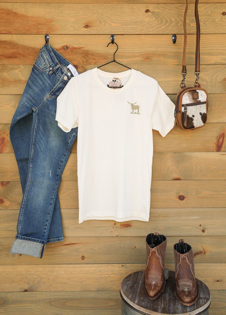 Rope Me I Wanna Play Tee Add a hint of Western fun to your look with the Rope Me I Wanna Play graphic tee! This sassy graphic cream colored tee with a brown Western graphic design features short sleeves, crew neckline, and is perfect for your layering needs or wearing alone. Show off your western style and pair it with your favorite jeans, shorts, or sweats. Product Details Graphic Tee Quote Cream Color Brown Graphic Design Short Sleeves Crew Neckline Unisex Sizing - Small, Medium, Large, XLarge Fitted Cream T-shirt With Crew Neck, Fitted Beige T-shirt Crew Neck, Fitted Beige Crew Neck T-shirt, Beige Fitted Crew Neck T-shirt, Cream Cotton Tops With Graphic Print, Graphic Print Beige T-shirt, Fitted Cream Crew Neck T-shirt, Casual Cream Pre-shrunk Tops, Beige Crew Neck Screen Print Top