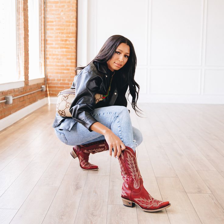 She's the perfect red cowgirl boot. Heirloom quality with a core western influence. The classic snip toe profile is embroidered to perfection with a twist on traditional flame stitch. Smoldering Ruby Red finish makes this a perfect fit for everyday to girl's night out. Heel Height: 1.75" Shaft Height: 13" Calf Circumference: 14" Ankle Circumference: 12" Toe Shape: Snip Signature Turquoise Soles Red Cowgirl Boots Outfit, Red Boots Outfit, Red Cowboy Boots Outfit, Red Cowgirl Boots, Turquoise Boots, Turquoise Clothes, Red Cowboy Boots, Cowgirl Style Outfits, Cowgirl Boot